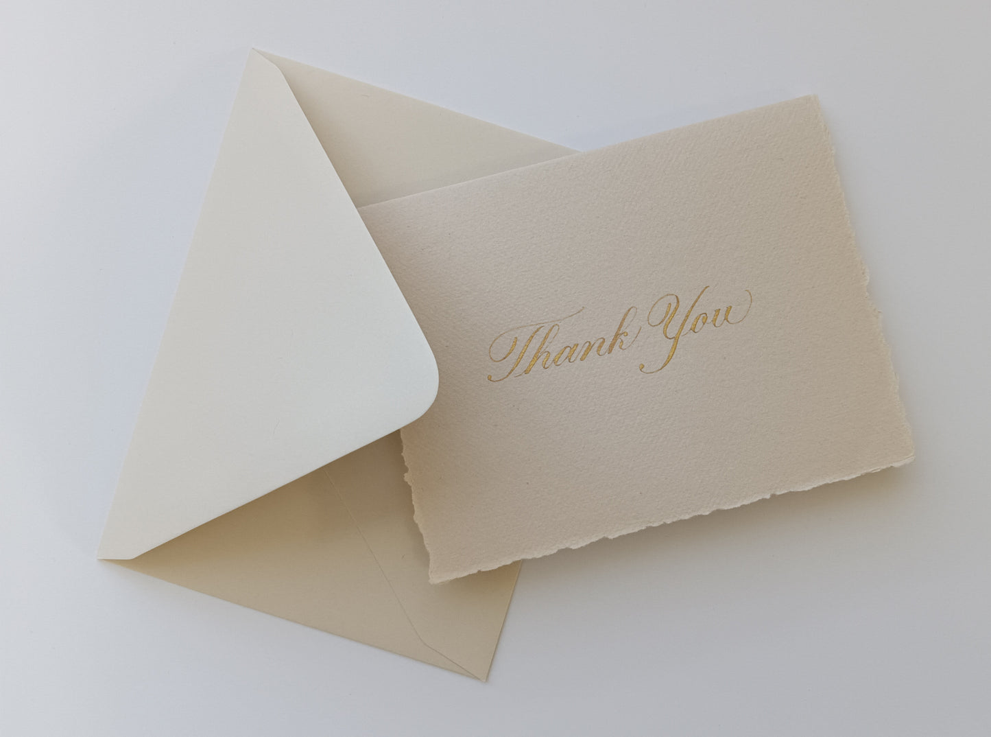 Beige card with 'Thank You' on a white background